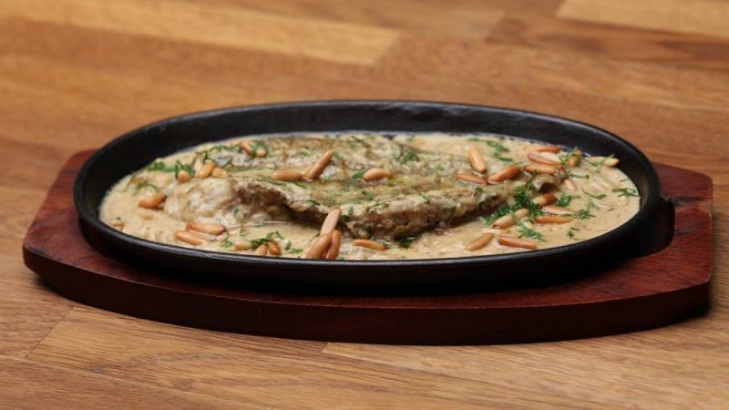 طاجن سمك الهامور مع صوص الطحينة